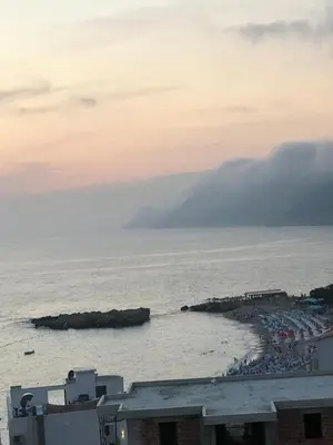 a view of a beach with a crowd of people at Apartmani Belma in Dobra Voda