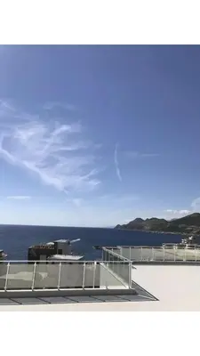 a view of the ocean from the deck of a ship at Apartmani Belma in Dobra Voda