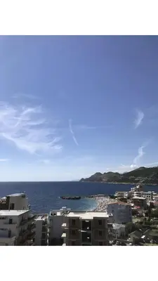 a view of a city and the ocean with buildings at Apartmani Belma in Dobra Voda