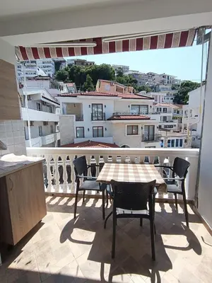 a table and chairs on a balcony with a view at Accommodation Milla in Ulcinj
