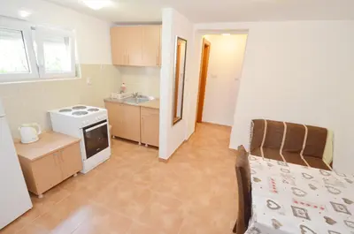 a room with a kitchen and a living room at Dubravcevic Residence in Tivat