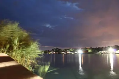 a view of a body of water at night at Cottage Ajna - Ada Bojana in Ulcinj