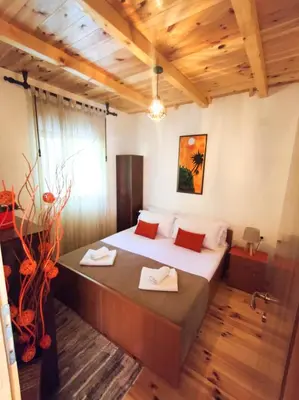 a bedroom with a large bed in a room at Cottage Ajna - Ada Bojana in Ulcinj