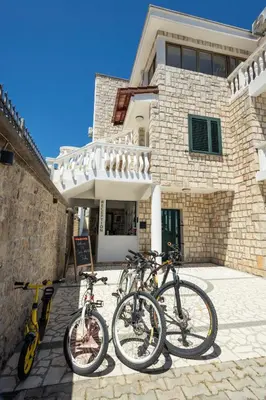 a group of bikes parked in front of a building at Guest House Pasha in Ulcinj