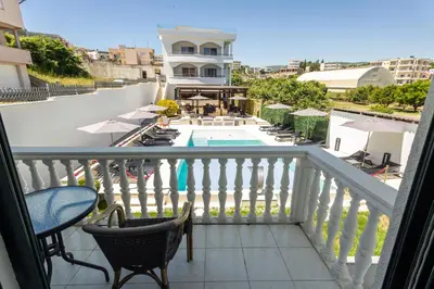 a balcony with chairs and a swimming pool at Guest House Pasha in Ulcinj