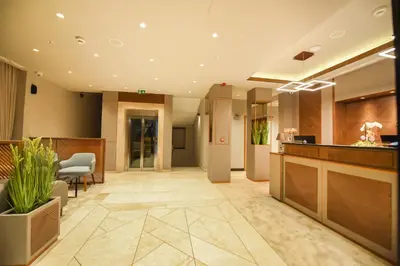 a lobby of a hotel with a reception desk at Hotel Union in Podgorica