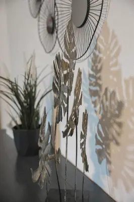 a bunch of metal flowers on a table at Casa Selimi in Ulcinj