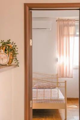 a mirror reflection of a bed in a room at Casa Selimi in Ulcinj