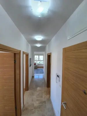 a hallway with a ceiling with a door and a room at AS Apartments Rafailovici in Rafailovici