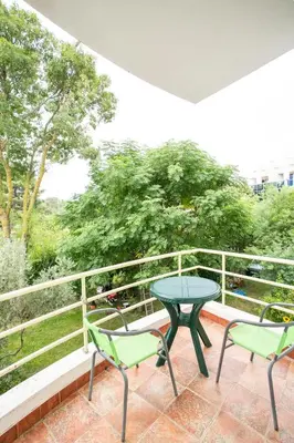 a patio with two chairs and a table on a balcony at Casa Agata in Ulcinj