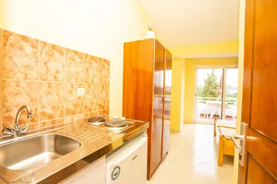 a kitchen with a sink and a counter top at Casa Agata in Ulcinj