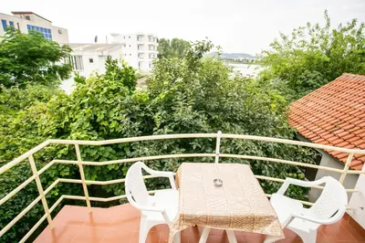 a balcony with a table and chairs on a balcony at Casa Agata in Ulcinj