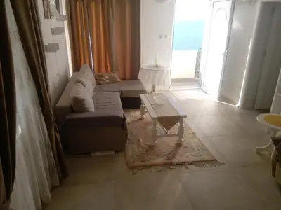 a living room with a couch and a table at Blue Horizon in Dobra Voda