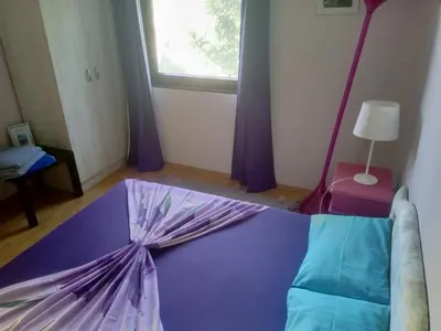 a room with a purple floor with an umbrella on the floor at Blue Horizon in Dobra Voda