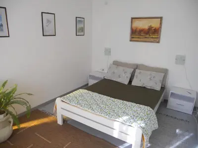 a bedroom with a bed in a room at Blue Horizon in Dobra Voda