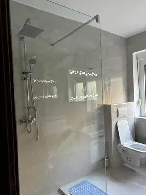 a bathroom with a shower and a toilet at Apartments Vidikovac Inn in Kotor