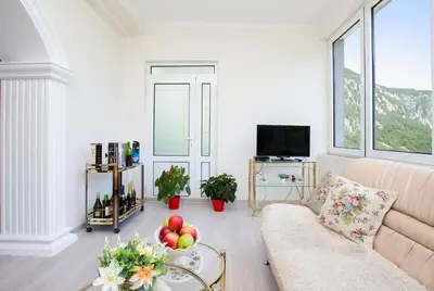 a living room with a couch and a table with fruit on it at Apartments Vidikovac Inn in Kotor