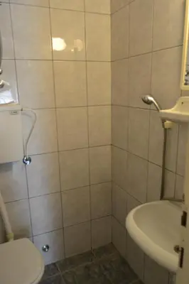 a bathroom with a toilet and a sink at Apartments Stanka in Becici