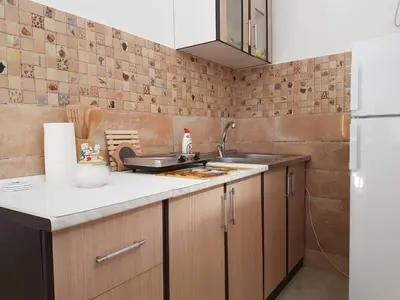 a kitchen with a sink and a counter top at Studio in Tivat