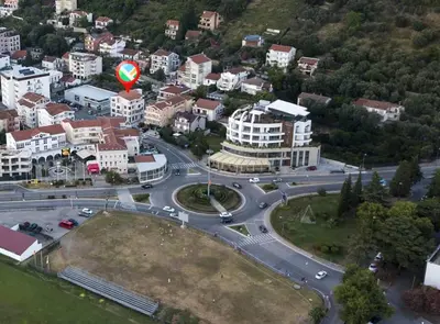an aerial view of a city with a round road at Apartments Boreta in Budva