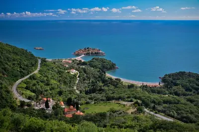 an aerial view of a resort on a hill next to the ocean at B&B Apart Hotel Paštrovski Konak in Sveti Stefan