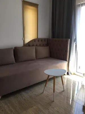 a living room with a couch and a table at Soheds in Budva
