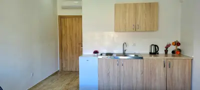 a kitchen with a sink and a counter top at Riviera Inn apartments in Ulcinj