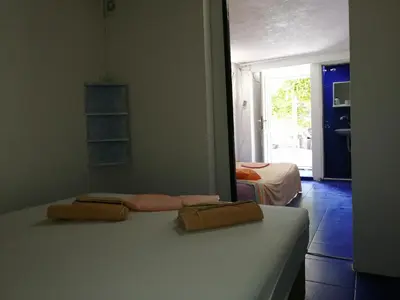 a bedroom with a bed with two towels on it at Aleksandar in Sutomore