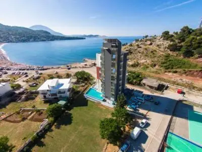 an aerial view of a building next to a beach at Aleksandar in Sutomore
