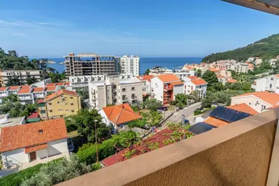a view of a city from a balcony at Apartments Pod Lozom with Seaview in Petrovac na Moru