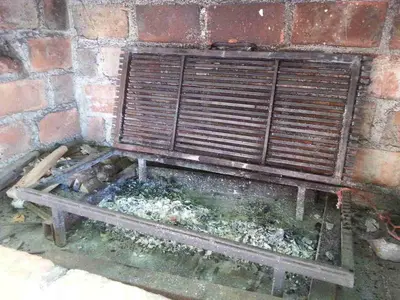 a wooden bench sitting against a brick wall at Apartmani Joca in Sutomore