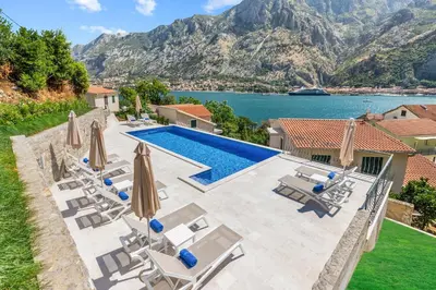 an image of a villa with a swimming pool at Apartments Dončić in Kotor