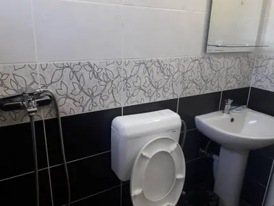 a bathroom with a toilet and a sink at S T A Apartmani in Ulcinj