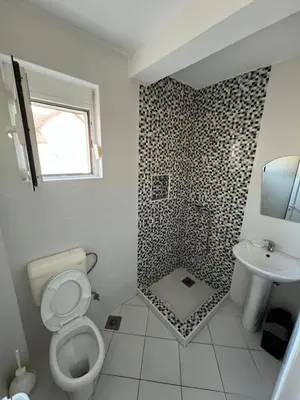 a bathroom with a toilet and a sink at S T A Apartmani in Ulcinj