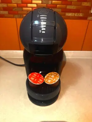 a black coffee maker with three buttons on a counter at Apartment M&M in Sveti Stefan