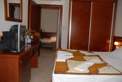 a hotel room with a bed and a tv at Apartments Krapina in Budva