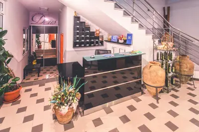 a store with a staircase and a room with plants at Apartments Deus in Dobra Voda