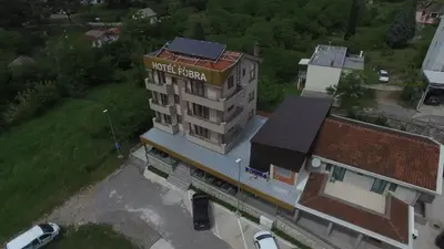 an overhead view of a building with a train station at Hotel Fobra in Podgorica