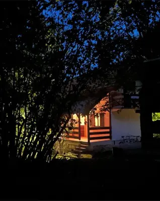 a house with a tree in front of it at LOVCEN4ME in Cetinje