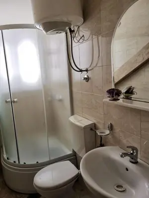 a bathroom with a shower and a toilet and a sink at Apartments Coso Zlatne njive bb in Kotor