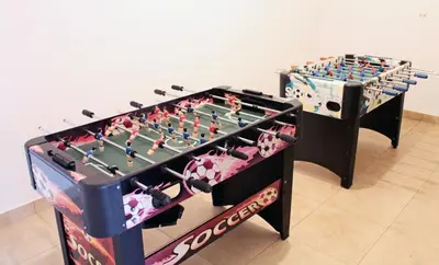 a large foosball table and a foosball at Apartments Villa Milna 1 in Budva
