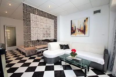 a living room with a couch and a table at Apartments Kruna Jovanović in Sutomore