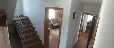 a hallway with a stairway leading to a living room at Zelena Maslina in Bar