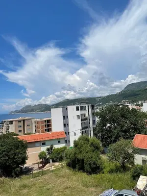 a white apartment building with a view of the ocean at Villa Dobre Vode in Dobra Voda