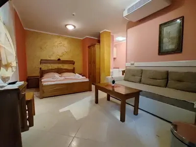 a living room with a bed and a coffee table at Villa Aleksandra - T in Rafailovici