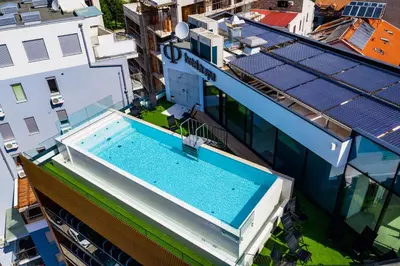 an overhead view of a building with a swimming pool at Hotel Fagus by Aycon in Budva