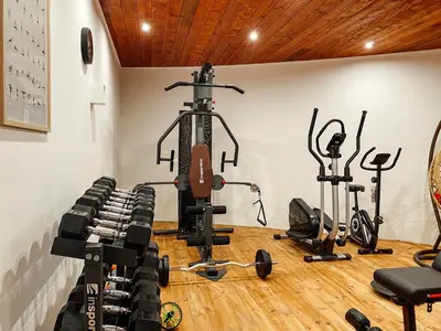 a gym with several treadmills and other exercise equipment at Hotel RESIDENCE in Ulcinj