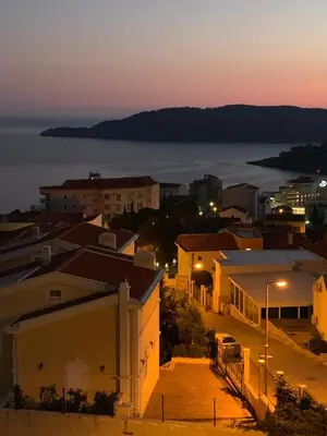 a view of a city at night at Ive Lole Ribara 38 in Becici