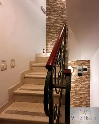 a staircase in a building with a brick wall at Apartments Wine House Old Town in Kotor