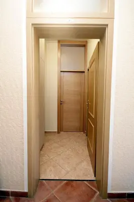 an empty hallway with a door in a room at Apartments Radosavovic in Bar
